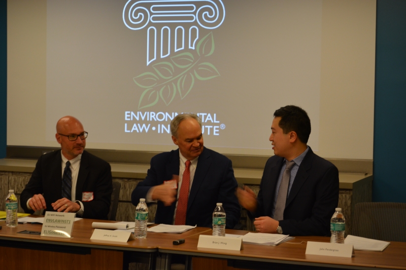 Jeffrey A. Smith and Brian J. Wong shake hands