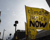 Climate justice now protest sign