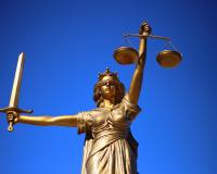 Lady Justice statue with blindfold and scales