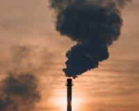 Smoke stack emitting smoke.