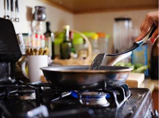 Cooking over a stovetop/Joshua Resnick/Shutterstock